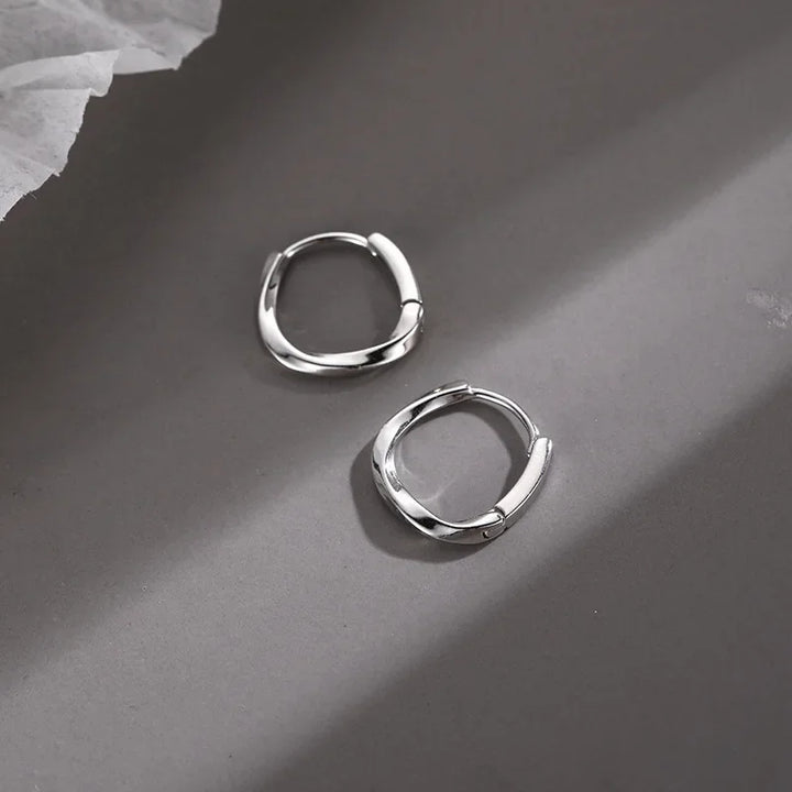 Boucles d'Oreilles Rondes Encrustées en Argent