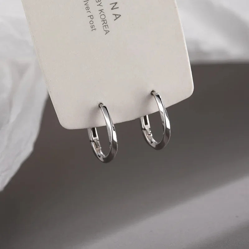 Boucles d'Oreilles Rondes Encrustées en Argent