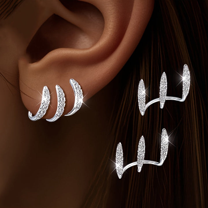 Boucles d'Oreilles Élégantes avec Trois Griffes et Strass