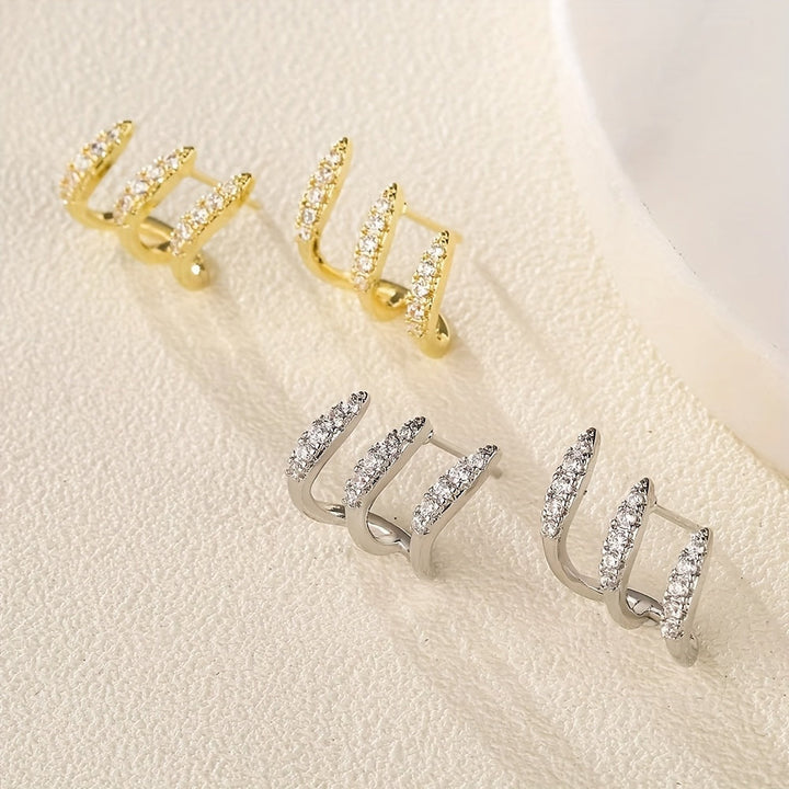Boucles d'Oreilles Élégantes avec Trois Griffes et Strass